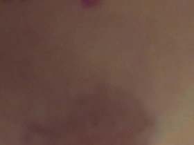 Asian woman gets her boyfriend ready for a night out