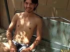 Asian man masturbates outdoors in gay solo video