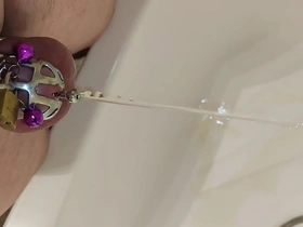 Trapped slave endure catheter and cock cage in solo BDSM session