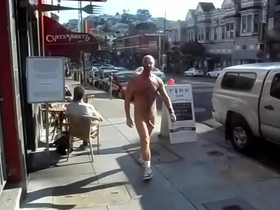 Daring woman bares all in broad daylight on a busy city street